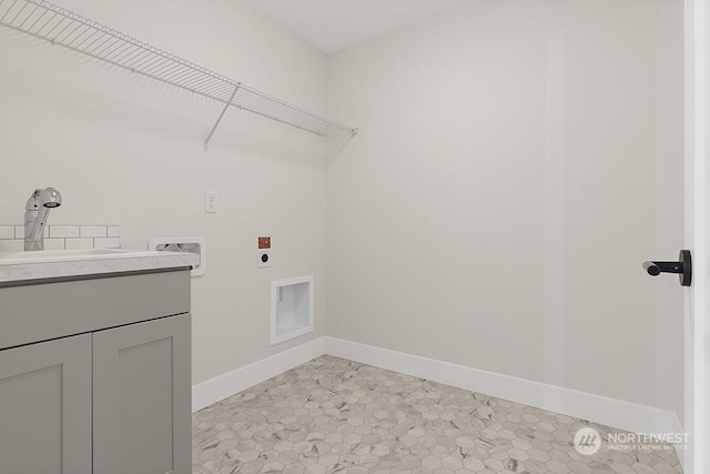 laundry room with cabinets, sink, hookup for a washing machine, light tile patterned floors, and hookup for an electric dryer