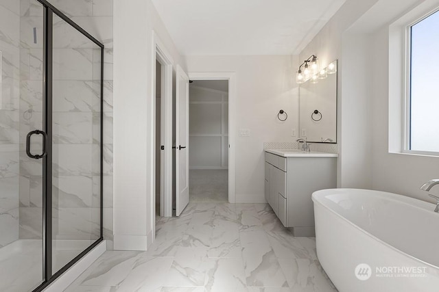 bathroom with a wealth of natural light, vanity, and independent shower and bath