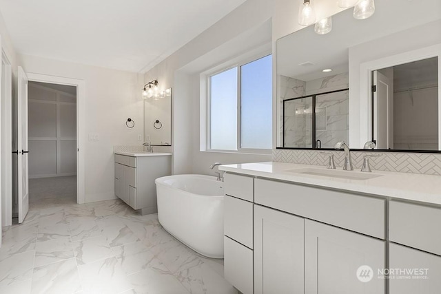 bathroom with vanity and an enclosed shower