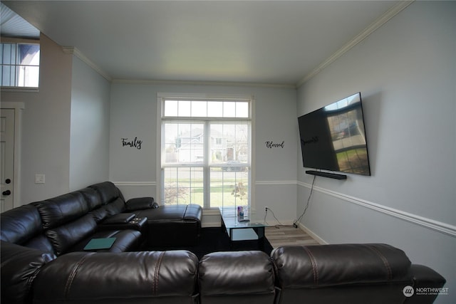 living room with hardwood / wood-style flooring and ornamental molding