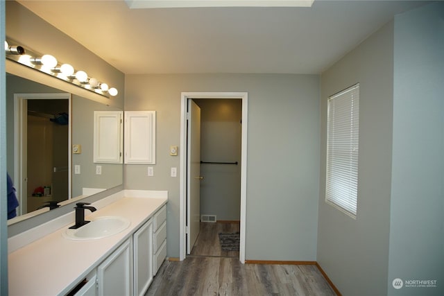 bathroom featuring vanity and wood-type flooring