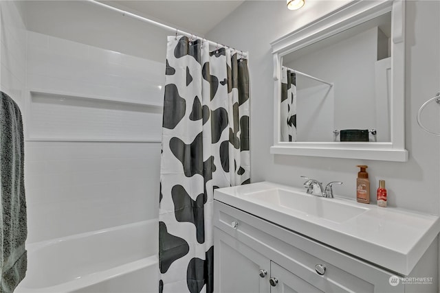 bathroom with shower / bath combination with curtain and vanity