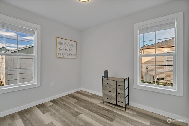 unfurnished room featuring light wood-type flooring