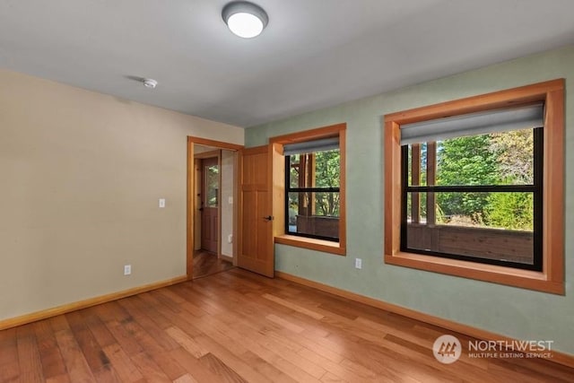 spare room with light wood-type flooring