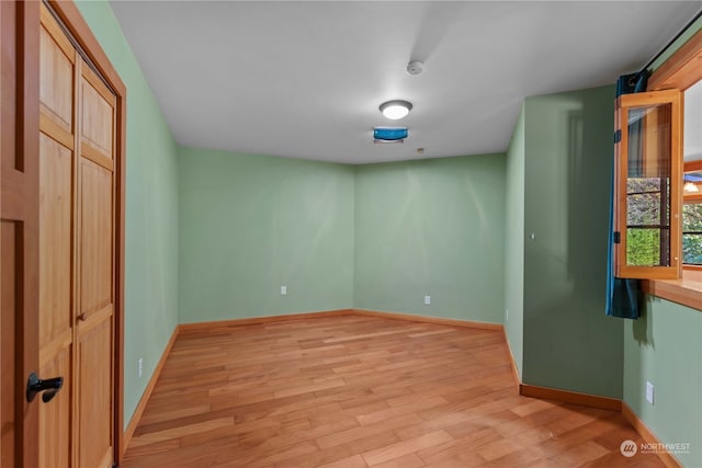 spare room featuring light hardwood / wood-style flooring