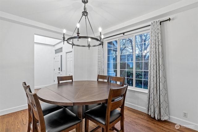 dining room featuring an inviting chandelier and hardwood / wood-style floors