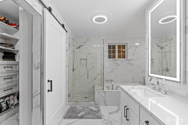 bathroom with vanity and shower with separate bathtub