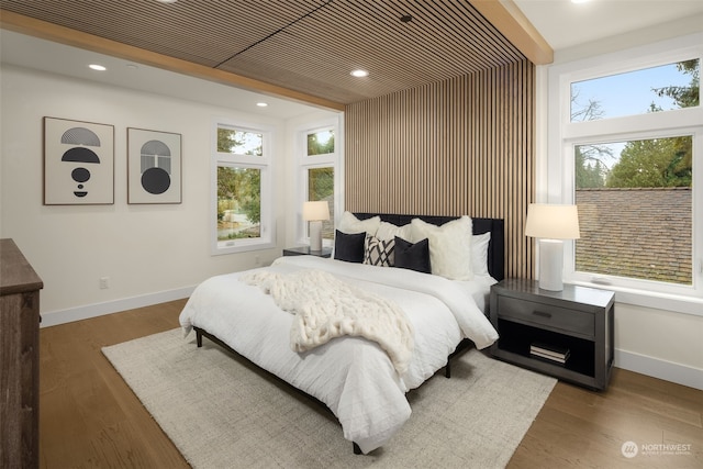 bedroom with wood-type flooring