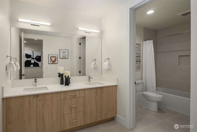 full bathroom with tile patterned floors, vanity, toilet, and shower / tub combo with curtain