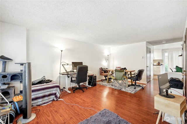 office area featuring hardwood / wood-style floors and a textured ceiling