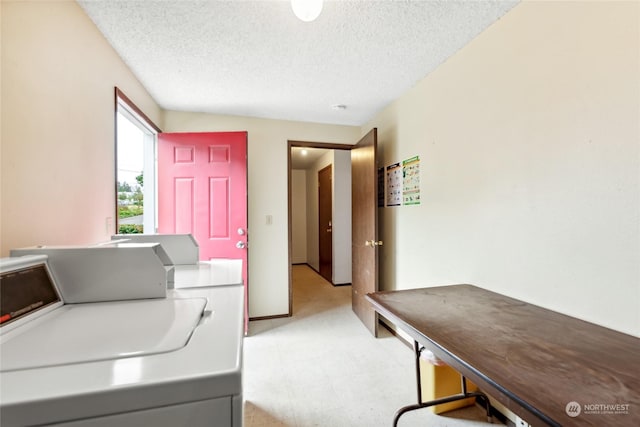 laundry room with washer / dryer and a textured ceiling