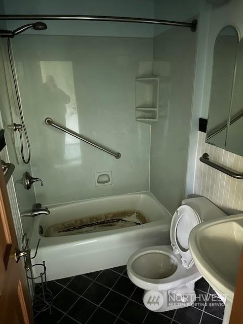 full bathroom featuring tile patterned floors, sink, shower / bathing tub combination, and toilet