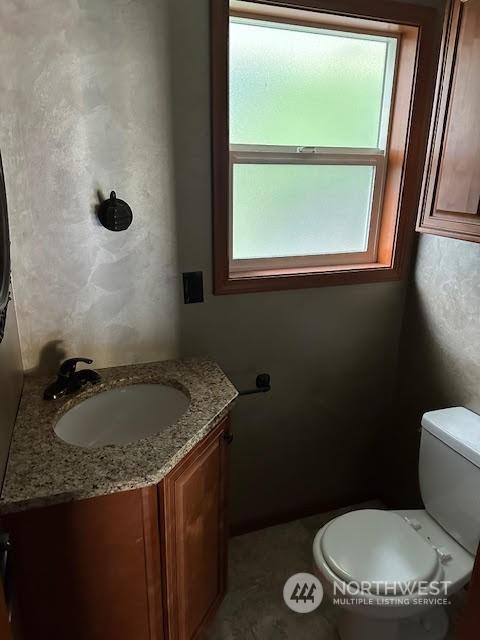 bathroom with vanity and toilet