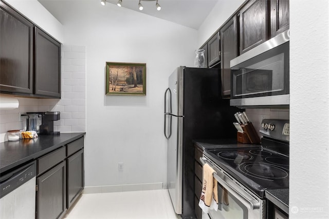 kitchen featuring stainless steel appliances, tasteful backsplash, and dark brown cabinetry