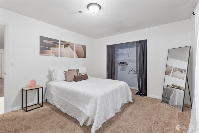 bedroom with light colored carpet