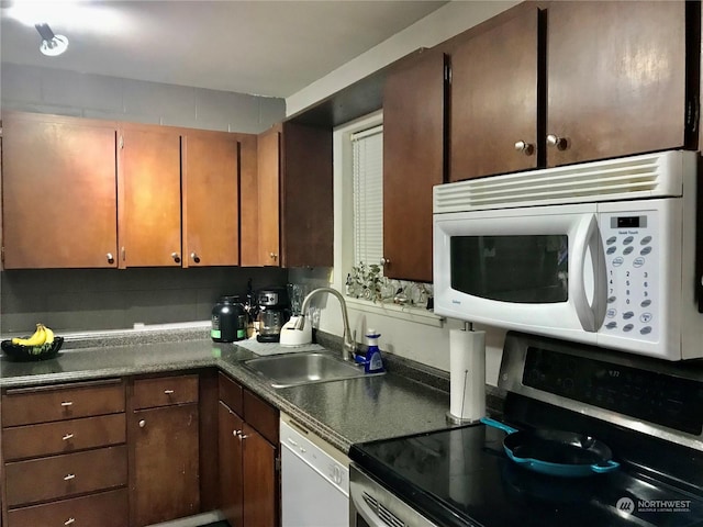 kitchen with white appliances and sink