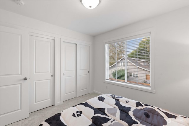 bedroom with light carpet