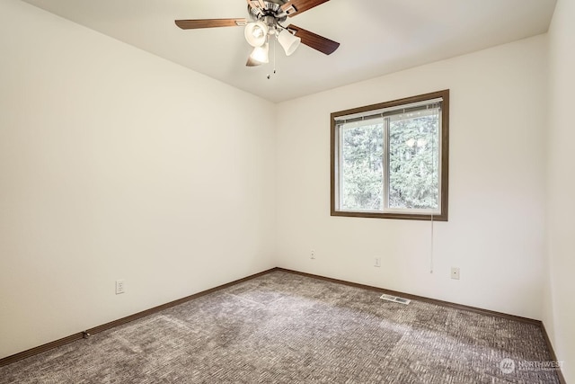 carpeted empty room featuring ceiling fan