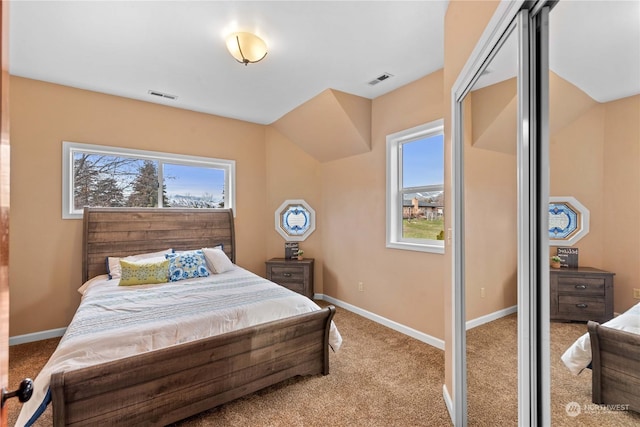 bedroom featuring light colored carpet