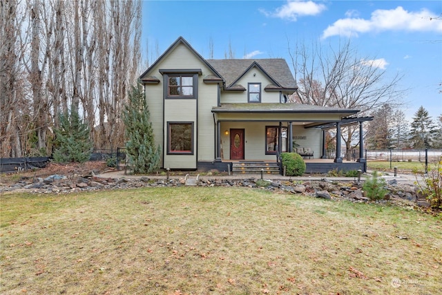 view of front of property with a front yard and a porch