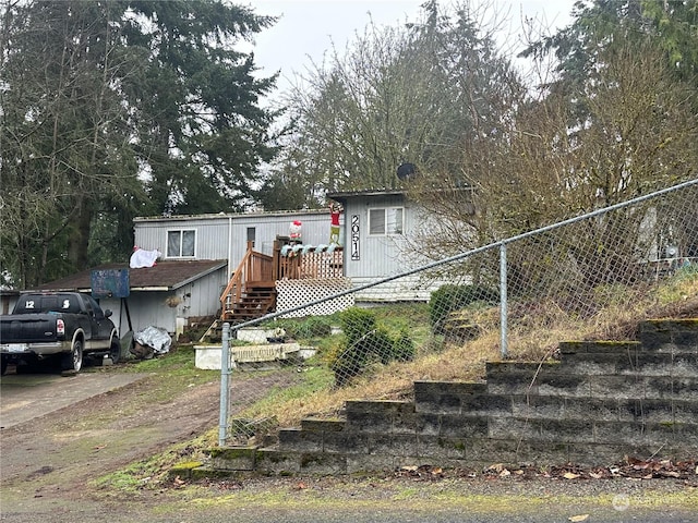 view of front of home with a wooden deck