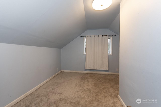 bonus room featuring carpet and lofted ceiling