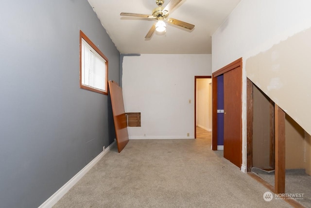 carpeted empty room with ceiling fan