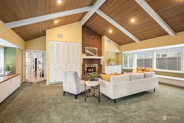 carpeted living room with beam ceiling, wooden ceiling, high vaulted ceiling, and a fireplace