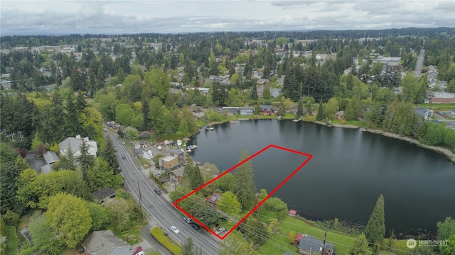 birds eye view of property featuring a water view