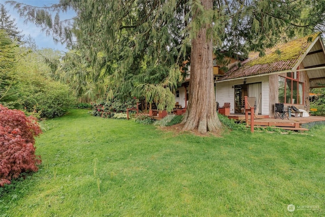 view of yard with a wooden deck