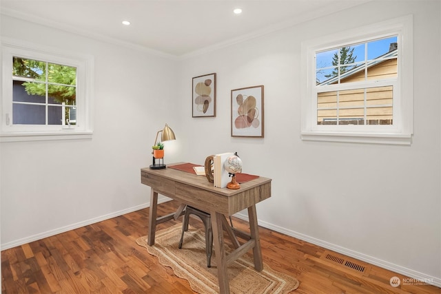 office area featuring hardwood / wood-style floors and crown molding