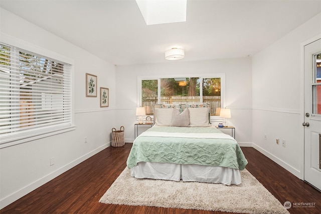 bedroom with dark hardwood / wood-style flooring