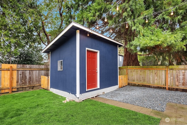 view of outbuilding with a lawn