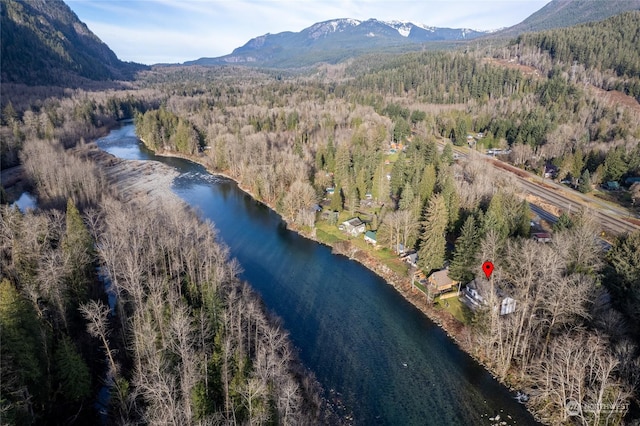 aerial view featuring a water and mountain view