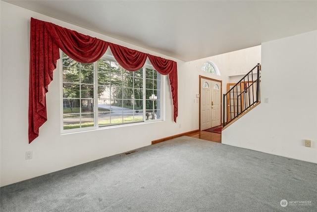 unfurnished living room with carpet flooring