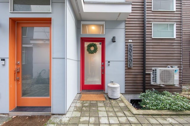 doorway to property featuring ac unit