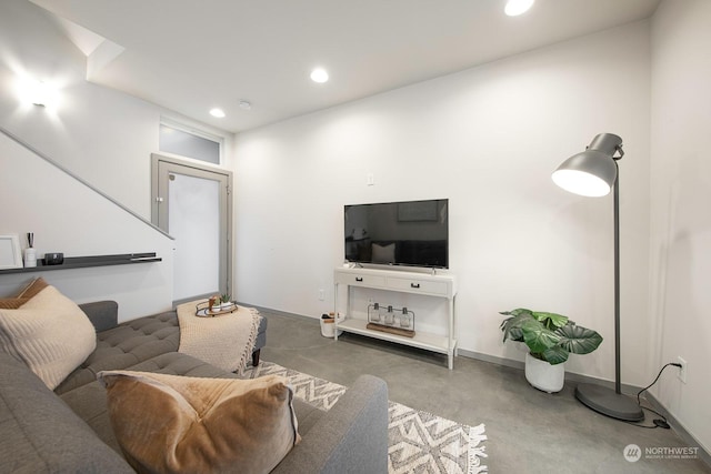 living room featuring concrete floors