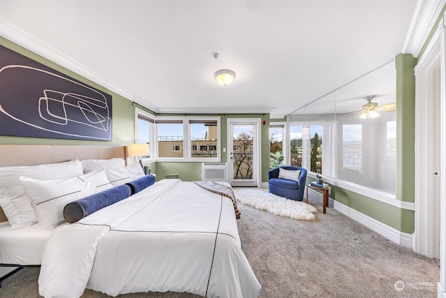 carpeted bedroom featuring crown molding