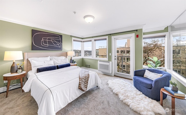 carpeted bedroom featuring ornamental molding, baseboard heating, and access to outside