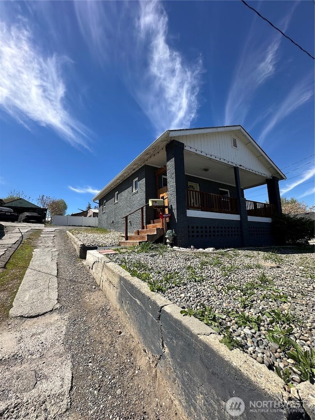 view of home's exterior featuring covered porch