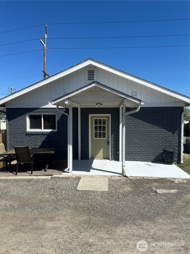 view of front of home with brick siding