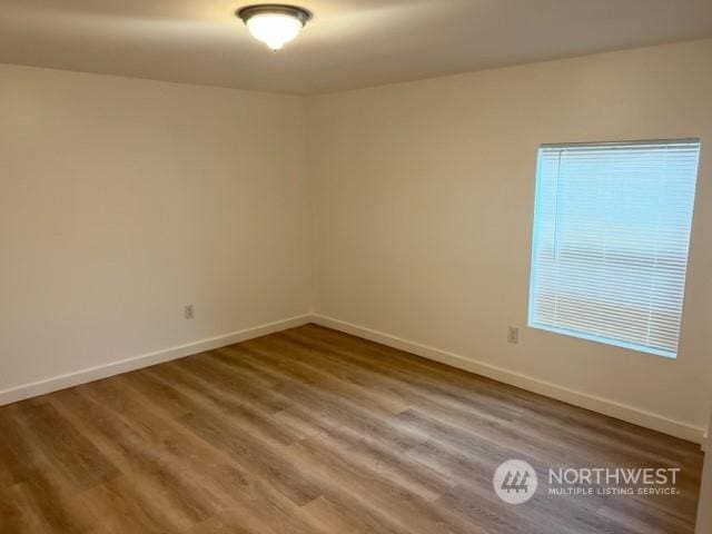 empty room featuring hardwood / wood-style flooring