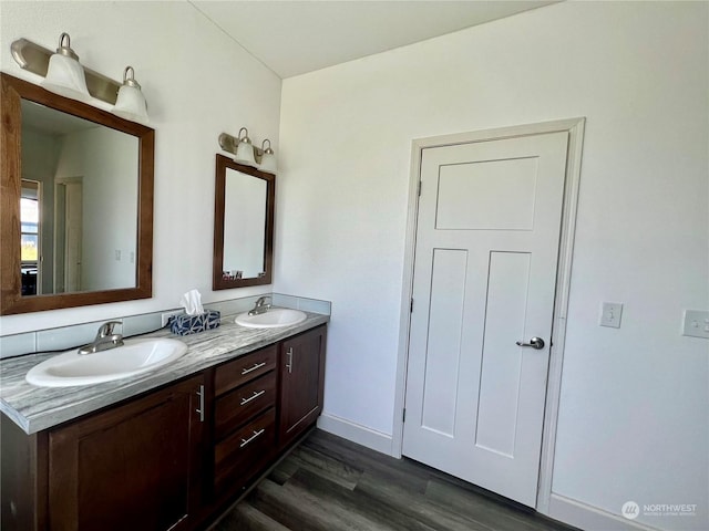 bathroom featuring vanity and hardwood / wood-style floors