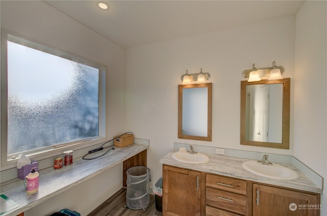 bathroom with hardwood / wood-style flooring and vanity