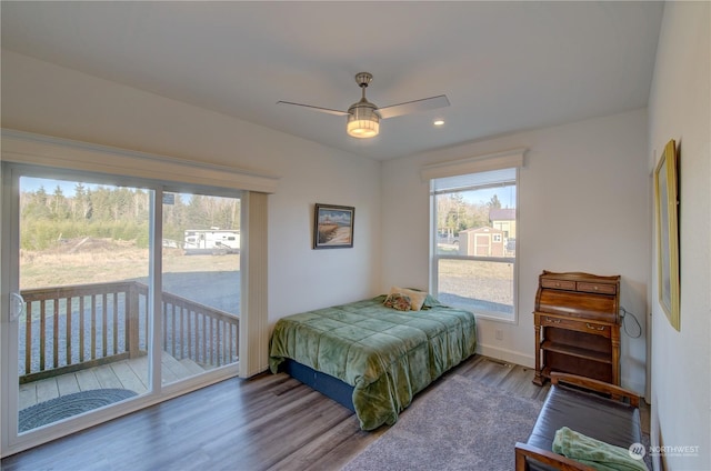 bedroom featuring ceiling fan, hardwood / wood-style floors, and access to outside