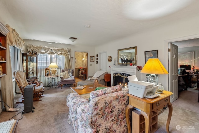 carpeted living room featuring a high end fireplace