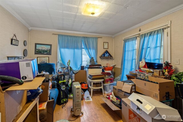 miscellaneous room with hardwood / wood-style flooring, crown molding, and a wealth of natural light