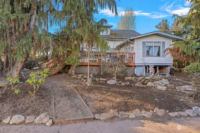 view of front of home featuring a wooden deck