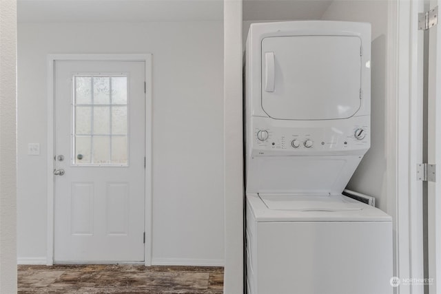 washroom with stacked washer / dryer and hardwood / wood-style floors