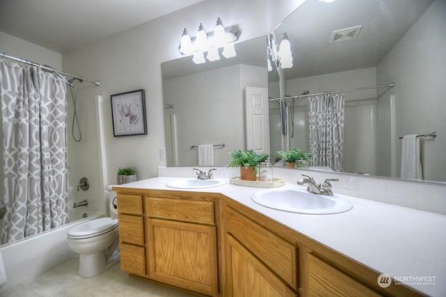 full bathroom featuring vanity, toilet, and shower / tub combo